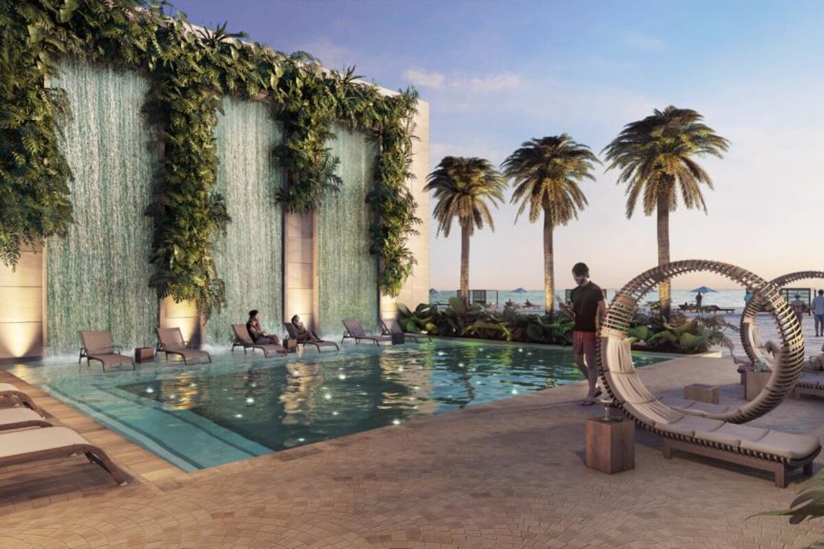 Image de synthèse de la piscine du club de plage de River Island, avec transats, cabanas et mur d'eau végétalisé, l'une des 16 piscines prévues à Atlántida.