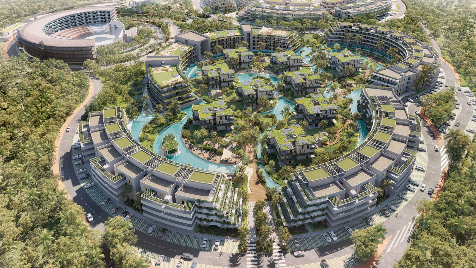 Aerial rendering of River Island's 692 residences inside the gated Atlántida master plan at Punta Cana, the river-pool network threading between the low blocks.